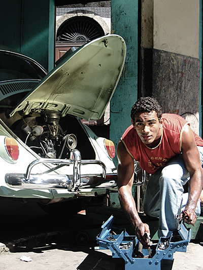 Man working on VW Bug